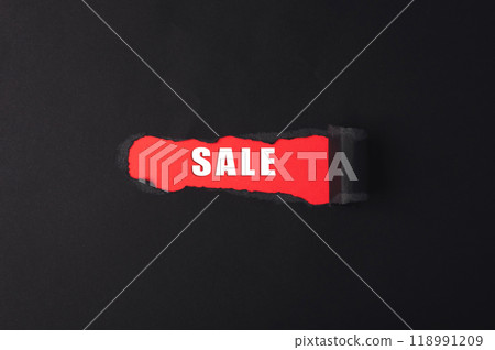 A red sign with the word Sale written on it 118991209
