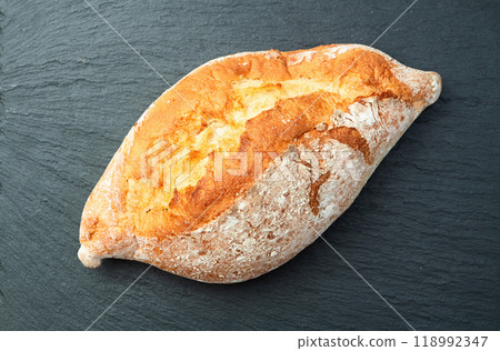 Loaf of  wheat hearth bread . Top view 118992347