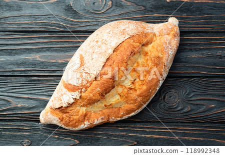 Loaf of wheat hearth bread . Top view Loaf of wheat hearth bread . Top view 118992348