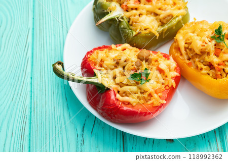 Baked stuffed pepper ( paprika ) with rice , carrot and meat . Top view on rustic background 118992362
