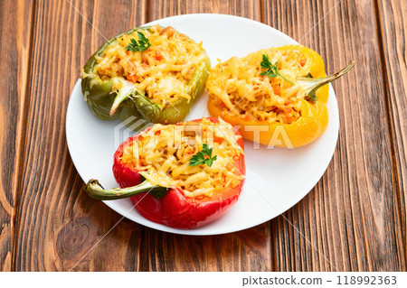 Baked stuffed pepper ( paprika ) with rice , carrot and meat . Top view on rustic background 118992363