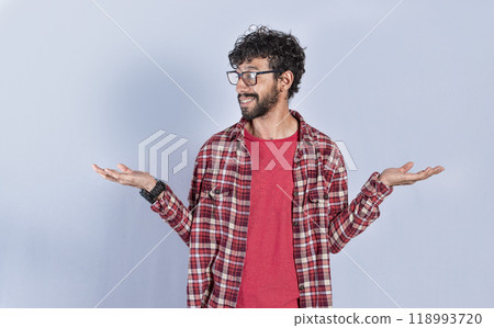 Young man balancing the palms of his hands ,Person comparing with the palms of his hands, a guy balancing the palms of his hands Young man balancing the palms of his hands ,Person comparing with the palms of his hands, a guy balancing the palms of his hands 118993720