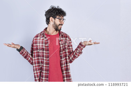 Handsome man balancing the palms of his hands ,Person comparing with the palms of his hands, a guy balancing the palms of his hands 118993721
