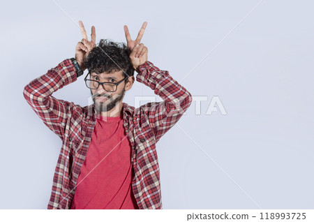 Isolated man with cuckolded fingers. concept of disloyalty, Cuckold man isolated, concept of infidelity and cuckolding, unfaithful person 118993725