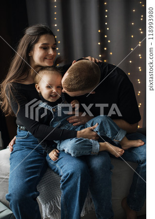 Happy family enjoying quality time together at home 118993980