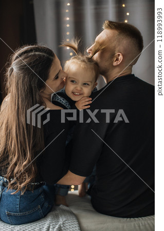 Loving family moment with parents and their young child Loving family moment with parents and their young child 118993993