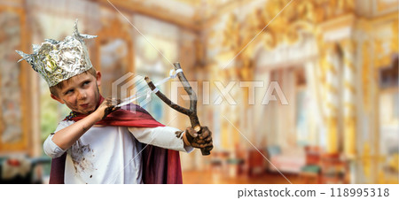 Little boy with a rocker dressed as a prince 118995318