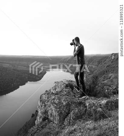 Photographer take a photo in the mountain Photographer take a photo in the mountain 118995321