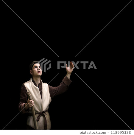 Praying man with raised hand Praying man with raised hand 118995328