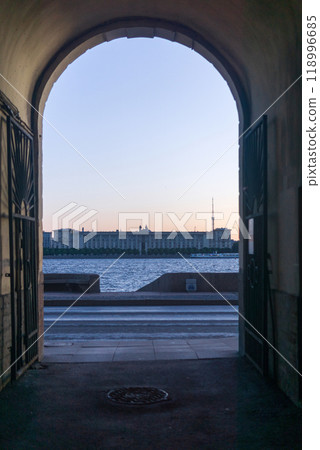 view from the gateway of an old building to the Neva River in Saint Petersburg during the White Nights view from the gateway of an old building to the Neva River in Saint Petersburg during the White Nights 118996685