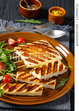 Grilled Greek Halloumi Cheese on sticks, top view Grilled Greek Halloumi Cheese on sticks, top view 118998222