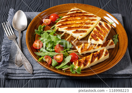 Grilled Greek Halloumi Cheese on sticks, top view Grilled Greek Halloumi Cheese on sticks, top view 118998223