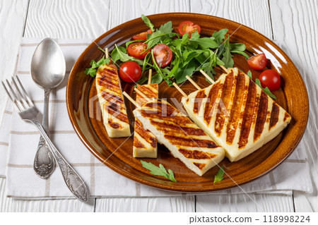 Grilled Greek Halloumi Cheese on sticks, top view Grilled Greek Halloumi Cheese on sticks, top view 118998224