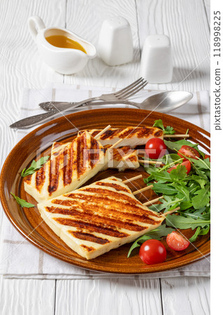 Grilled Greek Halloumi Cheese on sticks, top view 118998225