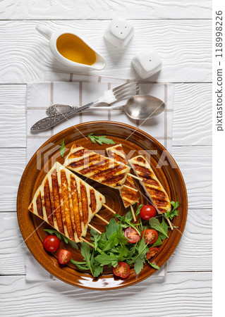 Grilled Greek Halloumi Cheese on sticks, top view 118998226
