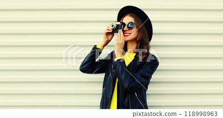 Portrait of happy smiling young woman photographer with film camera on white background Portrait of happy smiling young woman photographer with film camera on white background 118998963