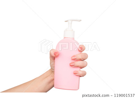 female hands hold liquid soap bottle with copy space female hands hold liquid soap bottle with copy space 119001537
