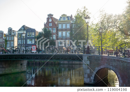 Sunny Morning on an Amsterdam Canal and Bicycles 119004198