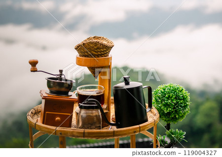Drip coffee, relax with a view of fog and mountains. Drip coffee, relax with a view of fog and mountains. 119004327
