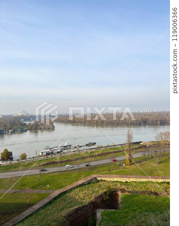 Looking across the Sava river in Belgrade, river boats and restaurants in autumn season. Looking across the Sava river in Belgrade, river boats and restaurants in autumn season. 119006366