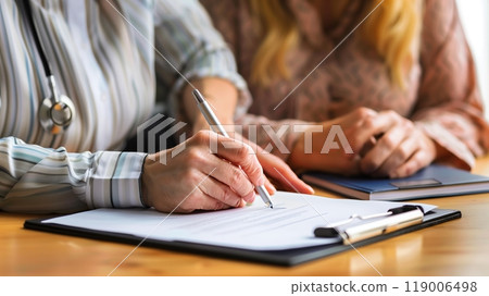 A person with a hearing impairment signs a contract, aided by a sign language interpreter and a lawyer. 119006498