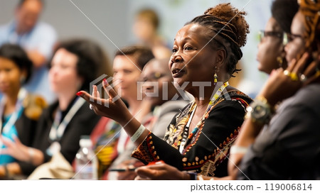 A passionate human rights activist speaks at an international conference, emphasizing global equality and justice. A passionate human rights activist speaks at an international conference, emphasizing global equality and justice. 119006814