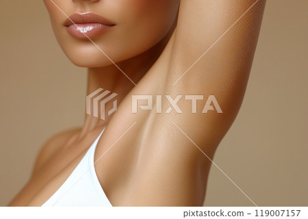 A womans smooth armpit and glowing skin, with soft lips and delicate light filtering through blinds A womans smooth armpit and glowing skin, with soft lips and delicate light filtering through blinds 119007157