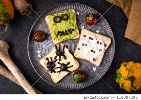 Halloween food for children, monsters toasts Halloween food for children, monsters toasts 119007288