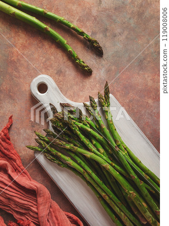 Bouquet of fresh asparagus, on an abstract background, top view, rustic, no people Bouquet of fresh asparagus, on an abstract background, top view, rustic, no people 119008006