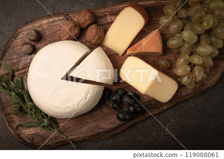 Georgian cheese, Imeretian and smoked suluguni, grapes, nuts, on a cutting board, Georgian cuisine, no people, 119008061