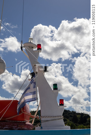 Boat mast and a greek flag, Astrakeri, Corfu, Greece 119008115