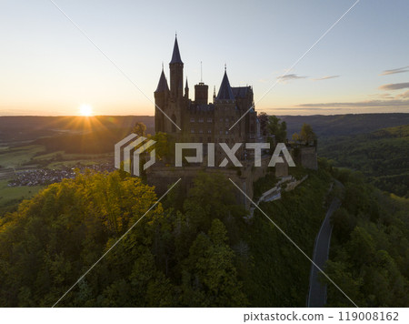 Silhouette of Famous Hohenzollern Castle at Golden Hour of Sunrise time, Baden-Wurttemberg, Germany. Aerial Drone Shot Silhouette of Famous Hohenzollern Castle at Golden Hour of Sunrise time, Baden-Wurttemberg, Germany. Aerial Drone Shot 119008162