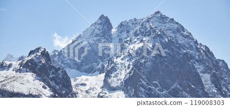 Snow mountain landscape banner, blue sky, rocky cliff. Wild nature. Hight mountains trekking 119008303