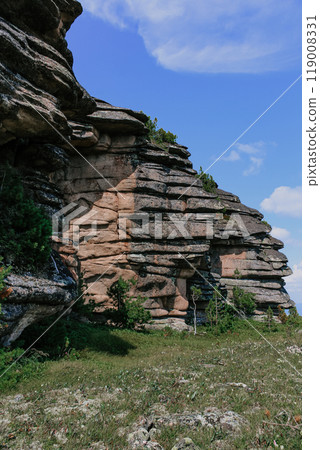 Natural Climbing training area in forest. Low syenite rock igneous mountain formation. cooled layers of magma. 119008331