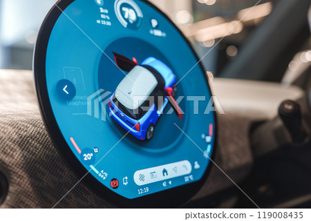 Detailed view of a car's digital dashboard featuring a 3D model, temperature settings, and connectivity options. Captured in London, UK. Detailed view of a car's digital dashboard featuring a 3D model, temperature settings, and connectivity options. Captured in London, UK. 119008435