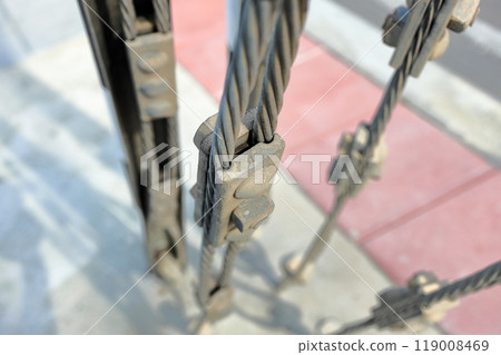 Close up steel turnbuckle and sling steel or Steel Wire Rope Sling and metal cable clamp connected with screw bolt in construction site. With selective focus. 119008469