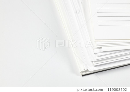 Close up stack of note papers isolated on white background.  Stationery item. 119008502