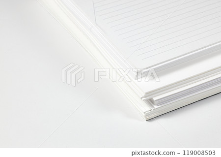 Close up stack of note papers isolated on white background.  Stationery item. 119008503