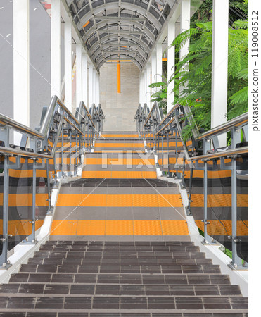 Long stair concrete in building, Staircase with stainless steel handrails, stairs in building corridor. Long stair concrete in building, Staircase with stainless steel handrails, stairs in building corridor. 119008512