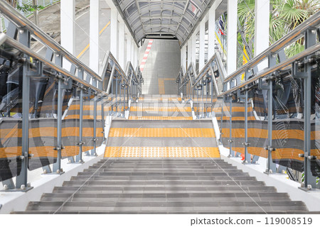 Long stair concrete in building, Staircase with stainless steel handrails, stairs in building corridor. Long stair concrete in building, Staircase with stainless steel handrails, stairs in building corridor. 119008519