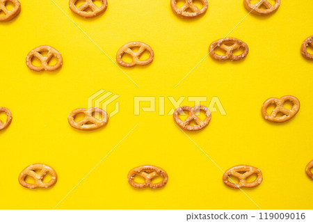 Pretzel in a plate on an isolated background. Pretzel texture. 119009016