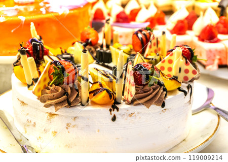 Yogurt Cake Decorated with Berries and Chocolate Yogurt Cake Decorated with Berries and Chocolate 119009214