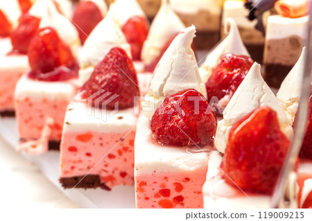 Strawberry Mousse Pastries with Whipped Cream and Fresh Strawberries 119009215