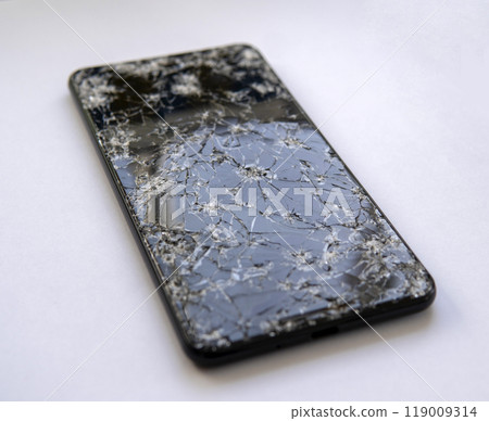 smartphone with broken screen on white background smartphone with broken screen on white background 119009314