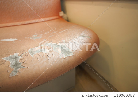 damage Leather with a cracked texture on a sofa . 119009398