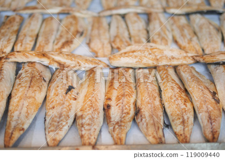 A beautifully presented platter featuring freshly grilled fish as the main attraction 119009440