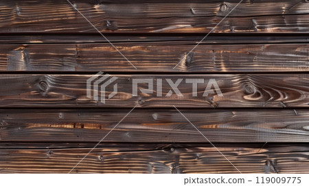 The wood's deep tones and unique grain patterns create a warm and inviting atmosphere, ideal for rustic design elements or cozy interiors, showcasing nature's beauty The wood's deep tones and unique grain patterns create a warm and inviting atmosphere, ideal for rustic design elements or cozy interiors, showcasing nature's beauty 119009775