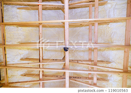 Under new frame houses, thermal foam insulation is installed under roof 119010563