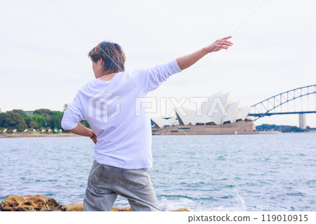 Back view of a Japanese dancer dancing in front of the Sydney Opera House 119010915