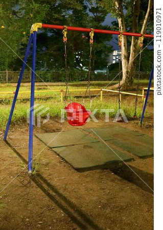 Late night in the park, empty playground equipment 119010971